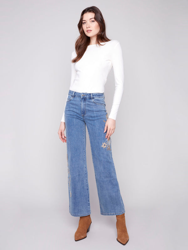 Elegant medium blue jeans with sequin details and stretch fabric for a perfect fit by Charlie B.