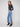 These jeans showcase exquisite lace embroidery at the hem, enhancing the classic straight-leg silhouette for a chic look by Charlie B.