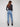 Five-pocket jeans in medium blue tone, designed for both fashion and function with beautiful hem embroidery accents by Charlie B.