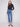 Medium blue denim jeans with a straight leg cut, showcasing their long length and stylish design by Charlie B.