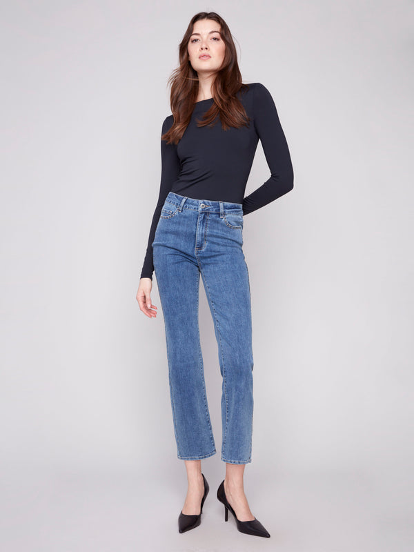 Medium blue denim jeans with a straight leg cut, showcasing their long length and stylish design by Charlie B.
