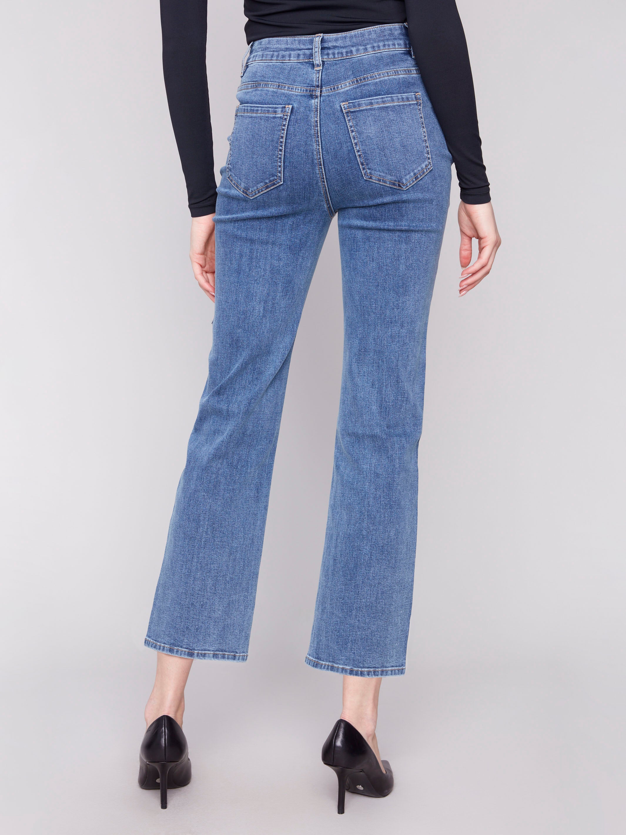 Blue denim jeans with a classic five-pocket design, perfect for everyday wear by Charlie B.