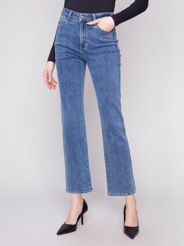Medium blue straight-leg jeans crafted from stretch denim material for ease of movement by Charlie B.