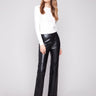 Black faux leather pants with a straight fit and stylish elastic waistband for comfort by Charlie B.