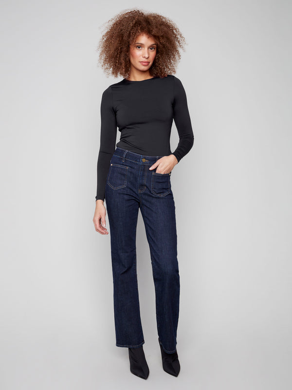 Deep blue jeans with a flare leg, featuring special rivets and front patch pockets for a stylish look by Charlie B.