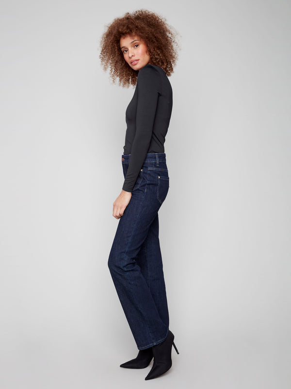 Flare jeans in deep blue with regular rise and unique rivet details, designed for both style and comfort by Charlie B.