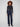 Stretch denim flare jeans in deep blue with front patch pockets and rivet accents for added flair by Charlie B.