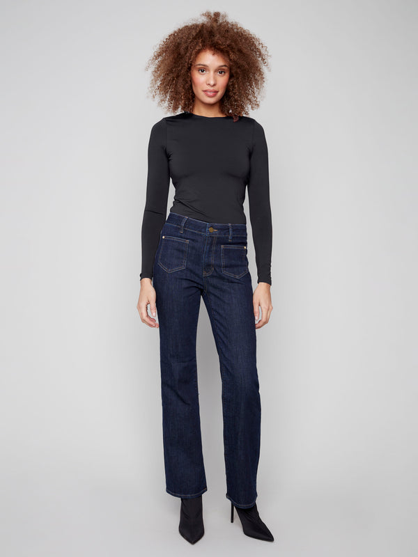 Stretch denim flare jeans in deep blue with front patch pockets and rivet accents for added flair by Charlie B.