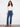 Indigo jeans with a regular rise and button details, crafted from stretch denim for comfort, designed by Charlie B.
