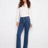 Indigo jeans with a regular rise and button details, crafted from stretch denim for comfort, designed by Charlie B.
