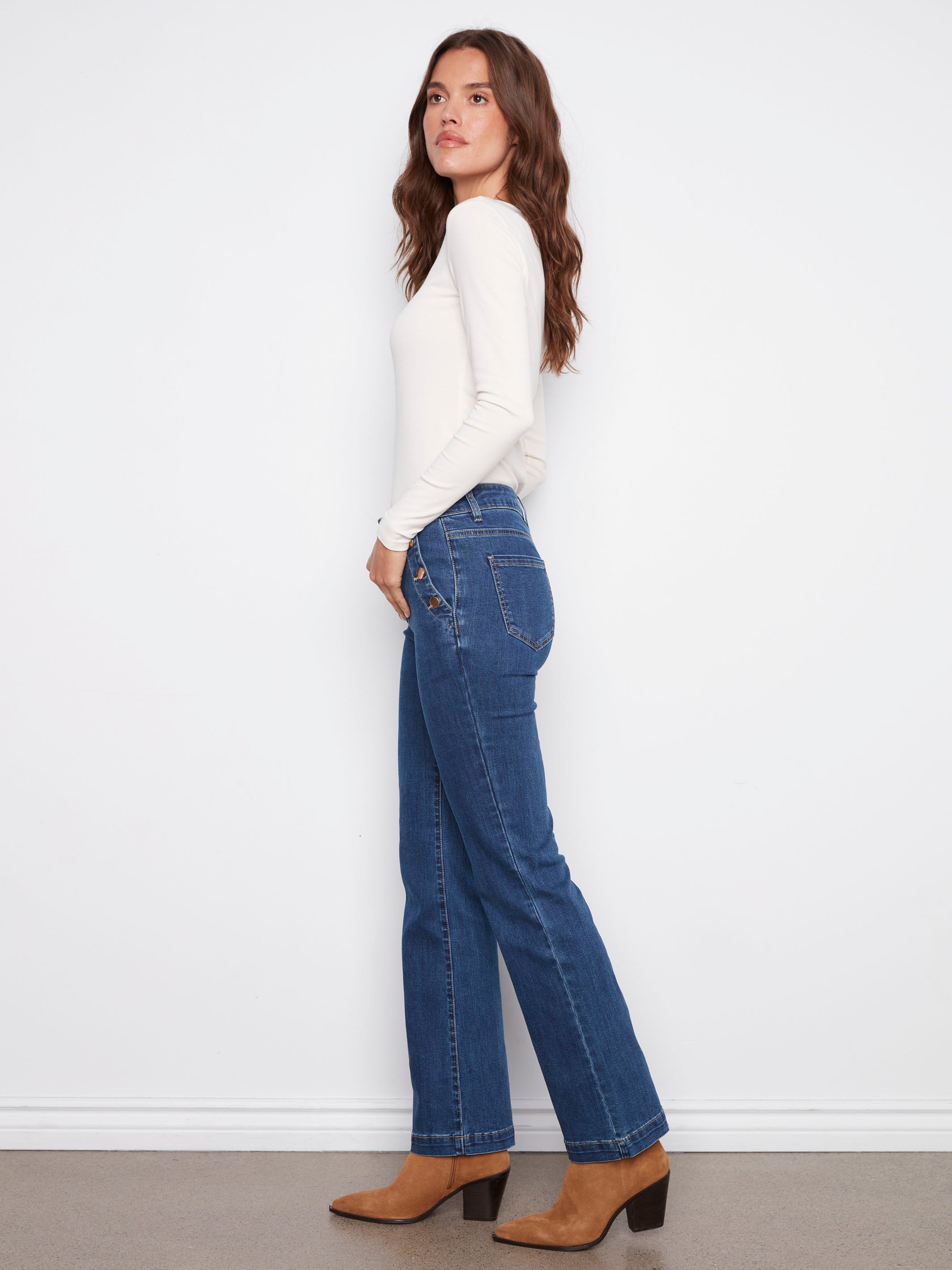 Crafted with back pockets and flare legs, these indigo jeans offer both style and functionality by Charlie B.