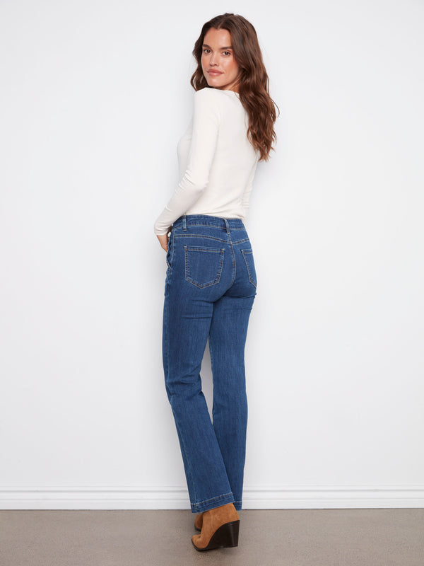 Stylish stretch denim jeans with button details on side pockets for a chic look, created by Charlie B.