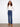 Regular rise indigo jeans featuring long length design and back pockets for added utility by Charlie B.