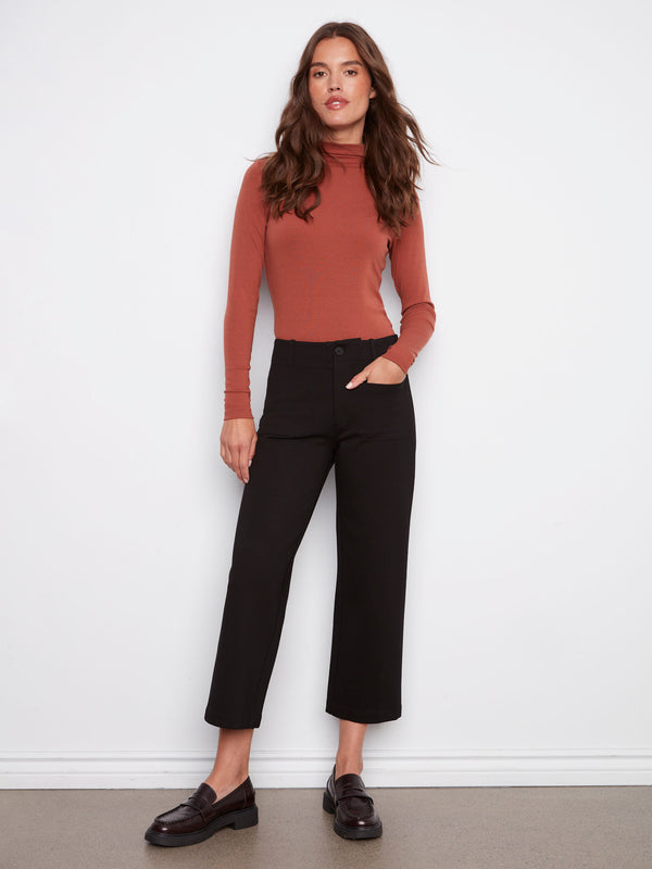 Black ponte pants with a cropped length, featuring two front patch pockets and belt loops for added style by Charlie B.