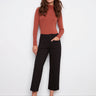 Black ponte pants with a cropped length, featuring two front patch pockets and belt loops for added style by Charlie B.