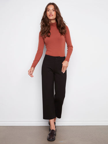 Designed with regular rise, these black wide-leg ponte pants ensure comfort and elegance in every move by Charlie B.