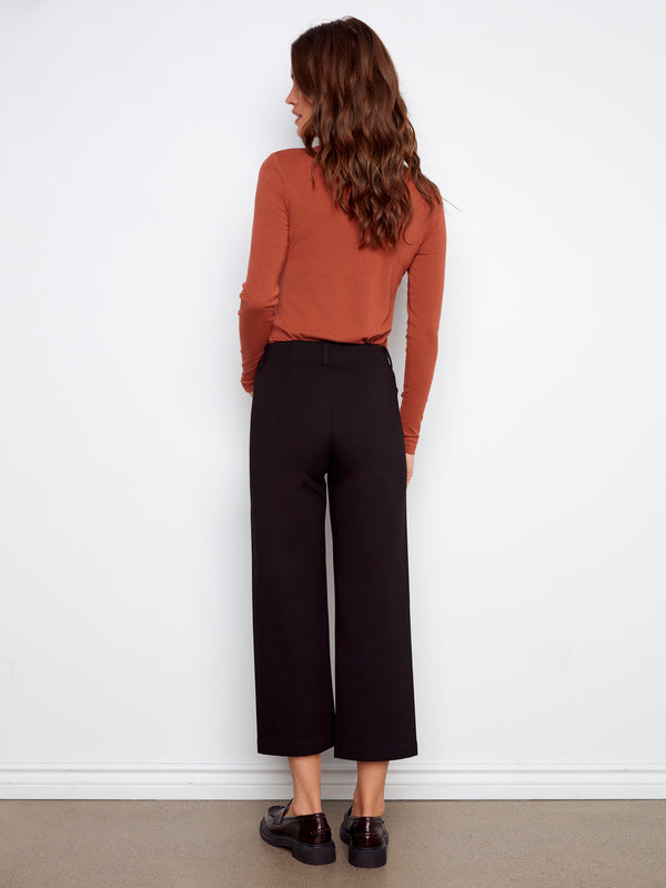 Crafted from stretch fabric, these black wide-leg ponte pants provide both flexibility and chic style by Charlie B.
