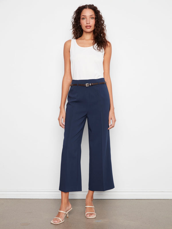 Navy pants with a belted waist, showcasing the cropped length and wide leg design for a chic look by Charlie B.