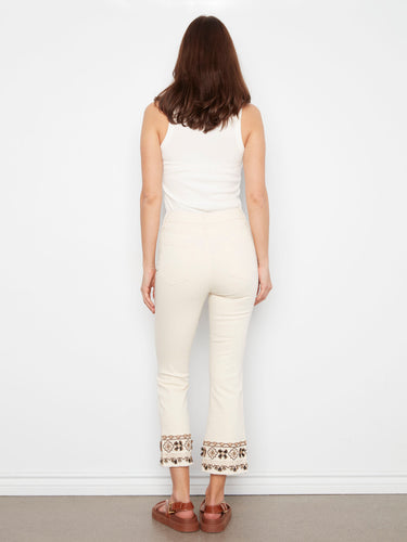 Natural cropped twill pants with flared leg design, accentuated by detailed hem embroidery by Charlie B.