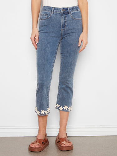 These cropped jeans feature stretch denim for added comfort and style, complete with a floral hem detail by Charlie B.