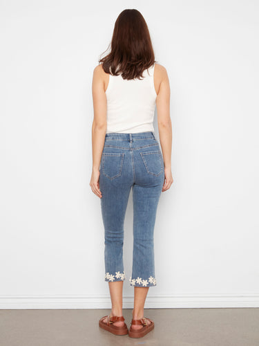 Stylish medium blue jeans featuring a flattering slim fit and flared leg, perfect for any casual outfit by Charlie B.