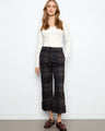 These pants showcase a chic wide-leg design, enhancing the plaid pattern and offering a stylish silhouette by Charlie B.