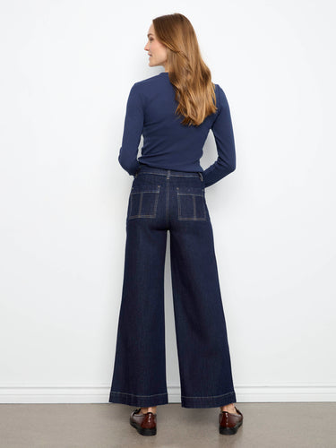 Button closure adds elegance to these regular rise jeans with ankle length cut, crafted from stretch denim by Charlie B.
