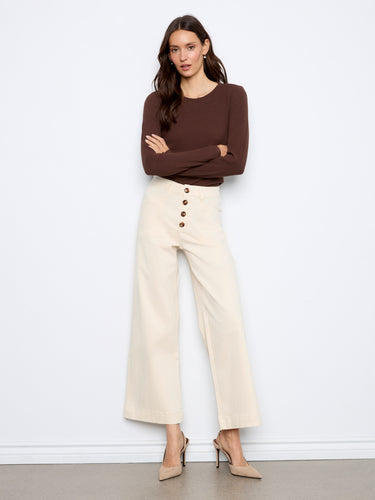 These wide leg trousers offer timeless elegance with their sleek button details, designed beautifully by Charlie B.