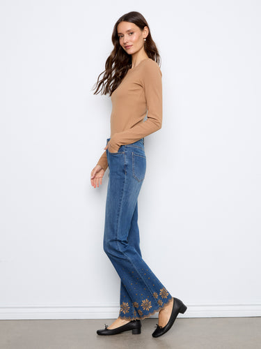 Regular rise indigo jeans with unique embroidered accents at the hem, offering both comfort and style by Charlie B.