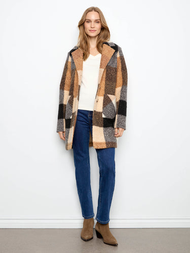 Chic coat featuring a button closure, adding a touch of elegance to any outfit. Ideal for layering in cooler weather by Charlie B.