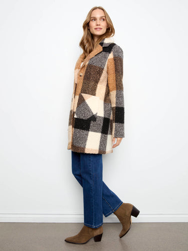 This versatile coat includes patch pockets and a tailored collar, combining functionality with timeless style by Charlie B.
