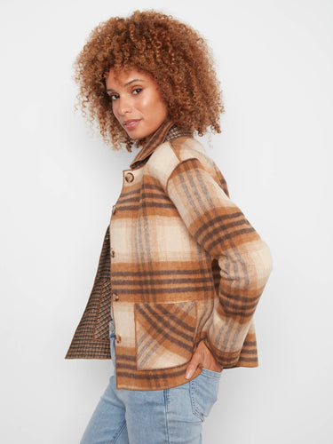 Plaid fabric showcases a button-front closure that blends practicality with aesthetic appeal seamlessly by Charlie B.