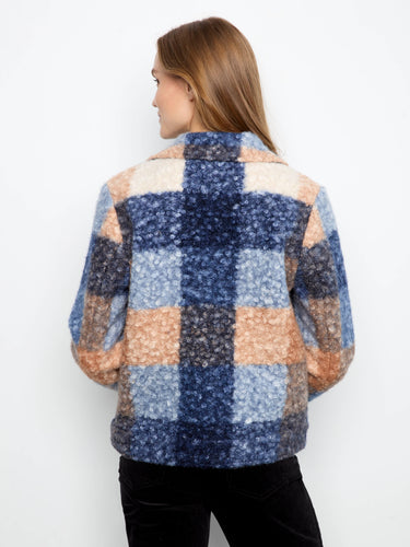 Contemporary jacket design incorporating welt pockets and intricate textures to enhance your wardrobe essentials. By Charlie B.