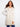 Champagne long hooded vest with a pearlized finish and welt pockets by Charlie B.