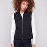 Elegant black vest with a floral quilted design and convenient welt pockets, perfect for layering by Charlie B.