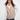 Greige quilted vest featuring convenient welt pockets, adding style and functionality to any outfit by Charlie B.