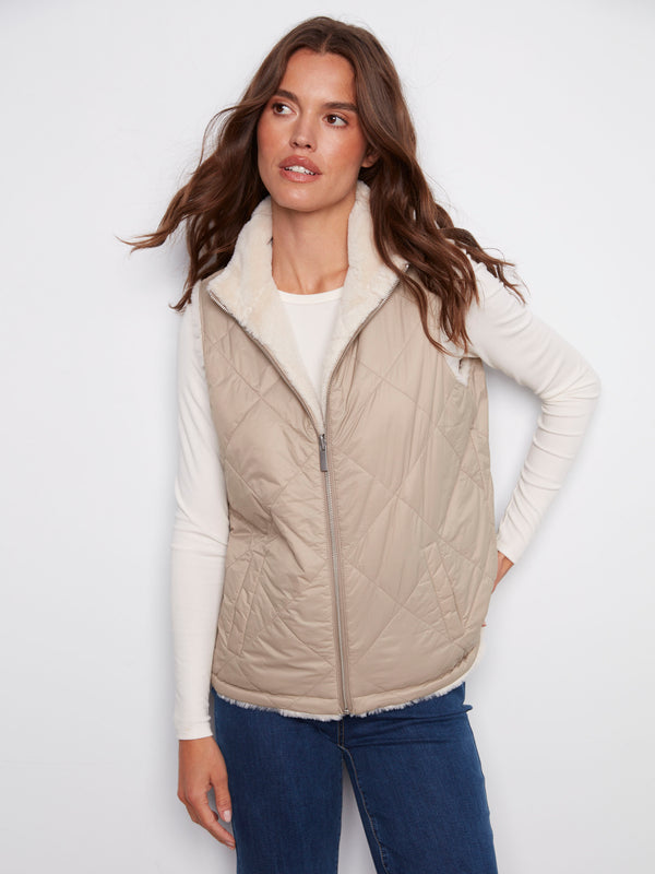 Greige quilted vest featuring convenient welt pockets, adding style and functionality to any outfit by Charlie B.