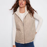 Greige quilted vest featuring convenient welt pockets, adding style and functionality to any outfit by Charlie B.
