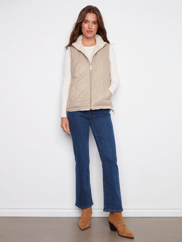 Stylish greige vest with a practical zipper front closure, perfect for layering in cooler weather by Charlie B.