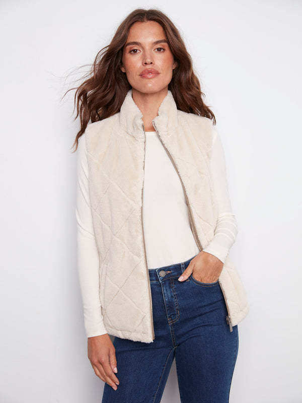 Elegant reversible design with quilted pattern on one side and plush faux fur on the other for diverse styling by Charlie B.