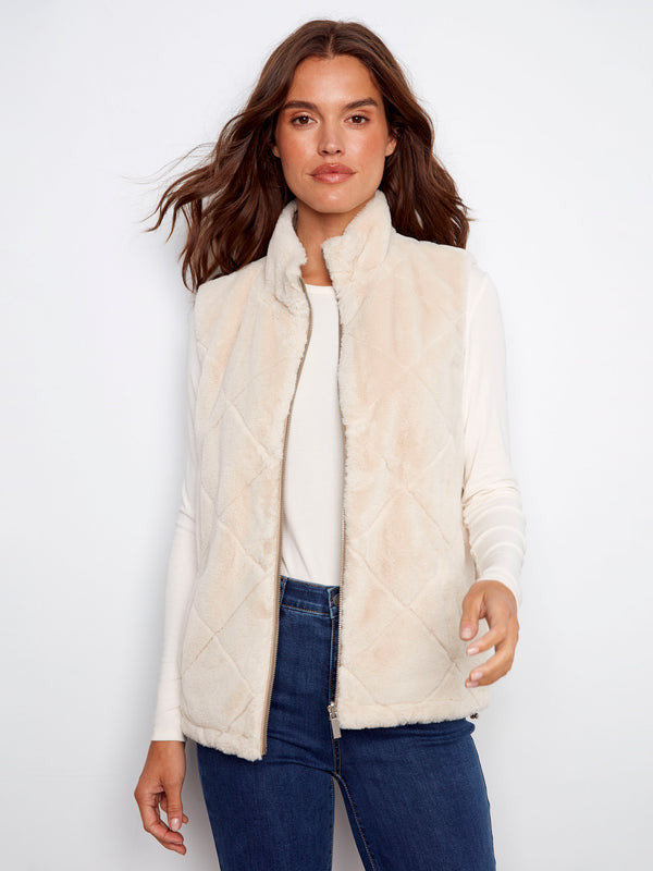 Luxurious faux fur texture adds a touch of sophistication to this reversible quilted vest ensemble by Charlie B.