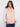 Chic ballet pink quilted vest featuring welt pockets for added style and convenience by Charlie B.