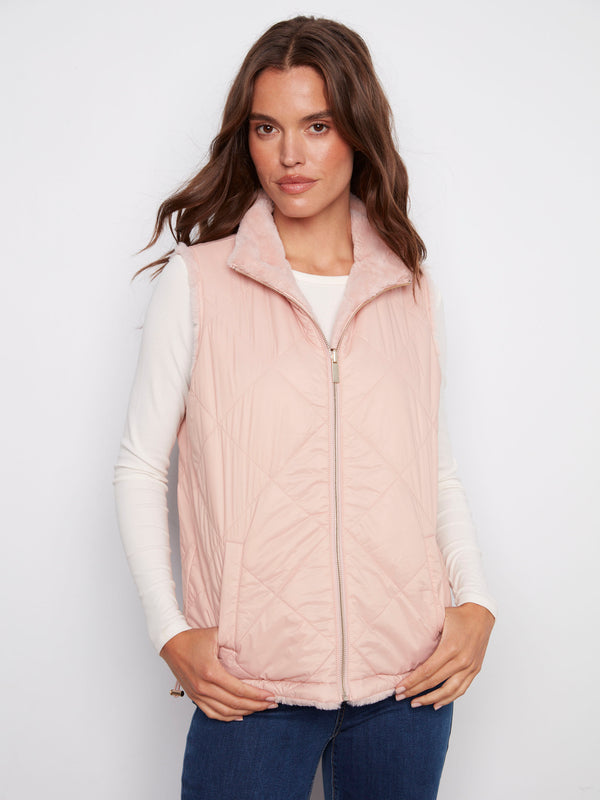 Chic ballet pink quilted vest featuring welt pockets for added style and convenience by Charlie B.