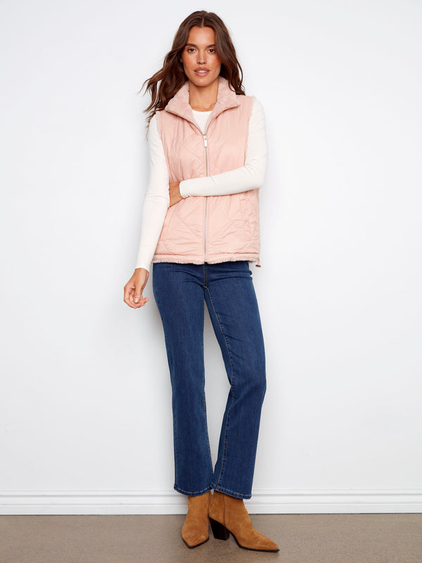 Elegant reversible vest in ballet pink, showcasing a quilted design with cozy faux fur lining by Charlie B.