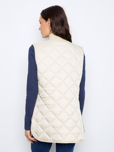 Stay stylish and cozy in this sleeveless quilted vest perfect for layering. By Charlie B.