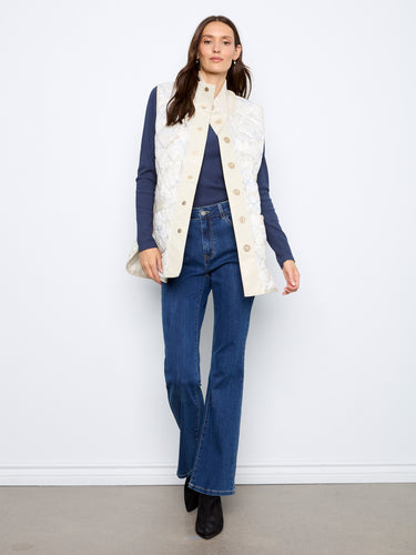 Snap-button closure enhances the classic appeal of this reversible quilted vest. By Charlie B.