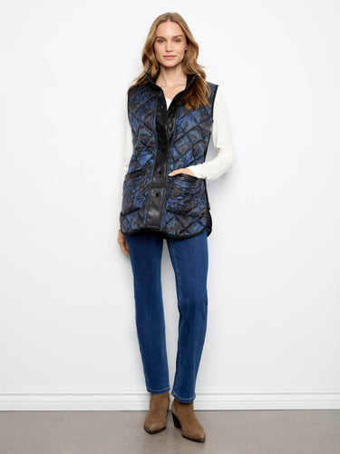 Side zipper details enhance the sleek silhouette of this modern sleeveless quilted vest by Charlie B.