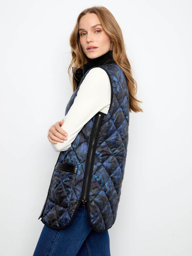 Stylish quilted outerwear featuring snap-button closure and reversible design for ultimate versatility. By Charlie B.