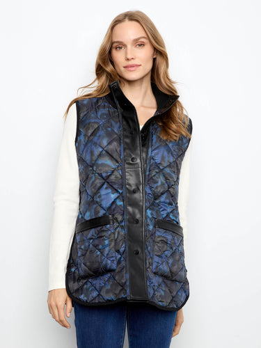 Fashion-forward reversible design in this quilted vest provides dual styling options effortlessly. By Charlie B.