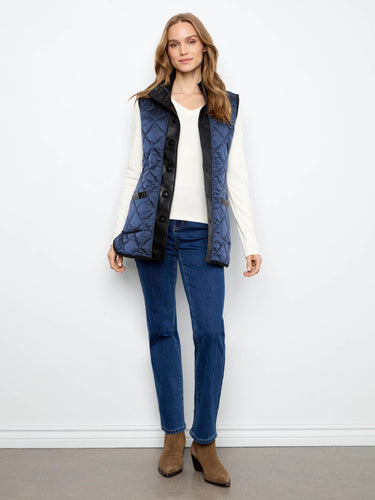 Functional and fashionable, this quilted piece includes welt pockets to keep essentials handy. By Charlie B.